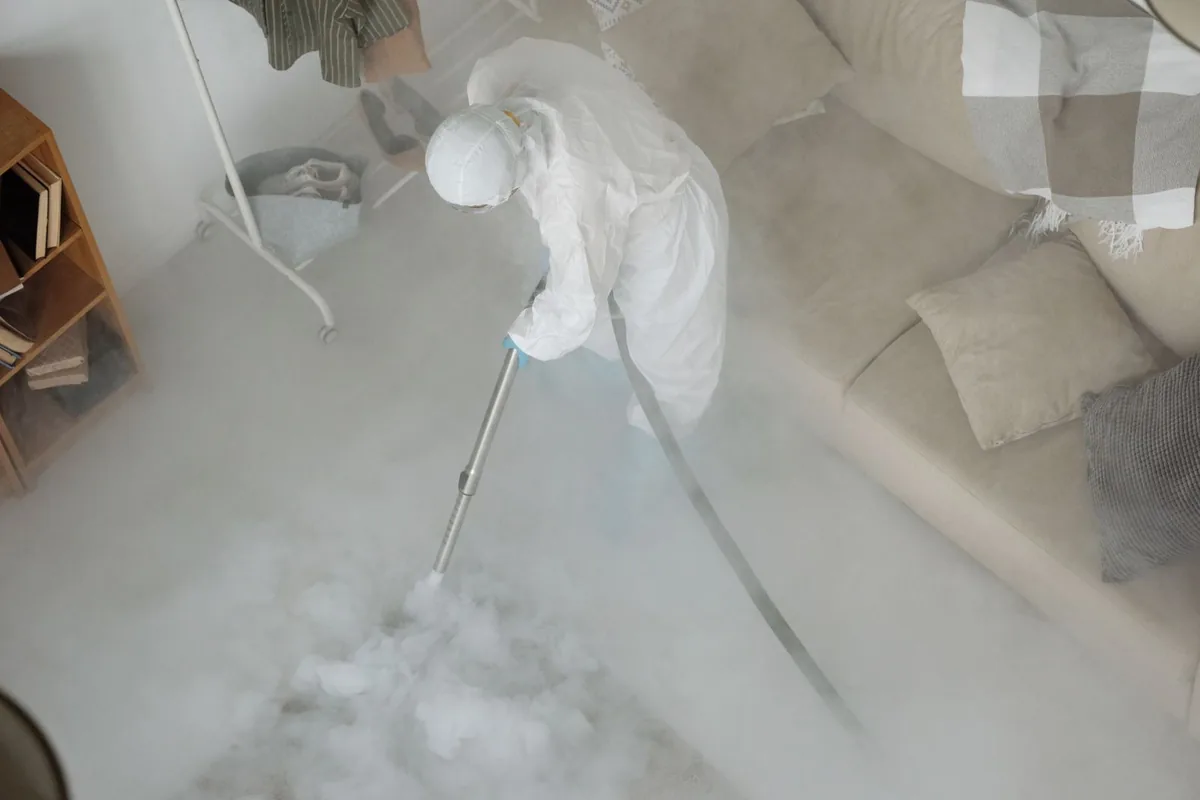 Biohazard cleanup technician in protective equipment, Williamstown, WV